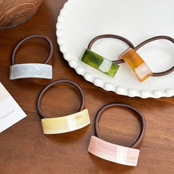 Custom minimalist gold logo acetate hair band view 3